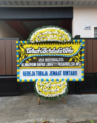 Papan Bunga Duka di Yuneri