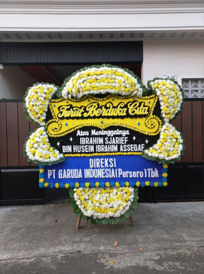 Papan Bunga Duka di Yuneri